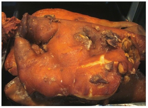 China Local Food Market: Cooked Pig Head.