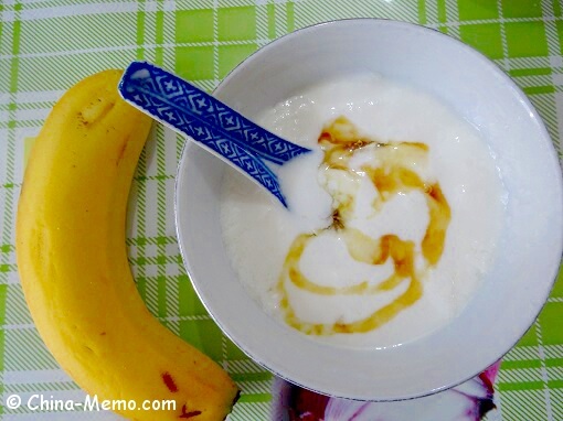 Chinese homemade yogurt with honey and banana.