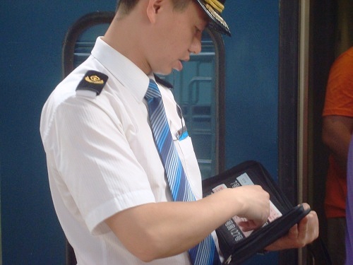 A Sleeper Train Staff Exchanges Your Ticket Before Boarding.