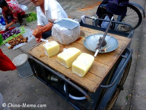 Chinese local selling rice tofu on a bike